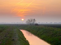 orange contrails  Contrails turn orange during sunset over dutch rural landscape : Netherlands, airplane, airspace, architecture, architectuur, atmosphere, avond, blauw, blue, boom, bouw, canal, condensatie spoor, condensation trail, condensstreep, congested, construction, contrail, crane, creative nature, crossing, crowded, dageraad, damp spoor, dawn, ditch, dramatic, dramatisch, druk, dusk, evening, field, geel, gras, grass, green, groen, groningen, holland, jet trail, kanaal, kraan, kruising, landelijk, landscape, landschap, lucht, luchtruim, main, nederland, onstwedde, orange, oranje, plane trail, pollution, red, river, rivier, rood, rook, rudmer zwerver, rural, schemering, sfeer, sky, sloot, smoke, spoor, summer, sunrise, sunset, traffic, vapor trail, veld, verkeer, verstopte, vervuiling, vliegtuig, vliegtuig spoor, voornaamste, water, yellow, zomer, zonsondergang, zonsopgang